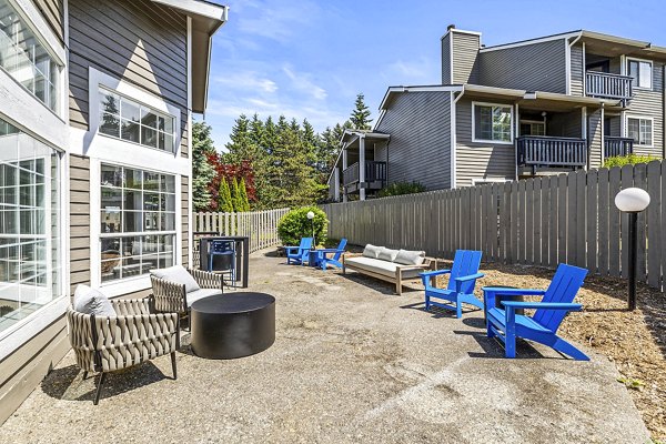 Cozy outdoor fire pit and patio area at Avana West Hill Apartments