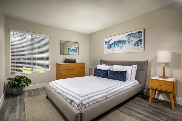 Cozy bedroom with modern decor in Stone Arbor Apartments featuring luxury living experience