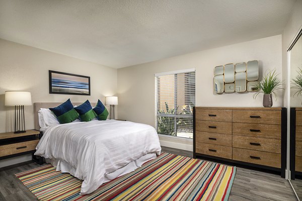 Stone Arbor Apartments: Cozy bedroom with elegant decor and natural light