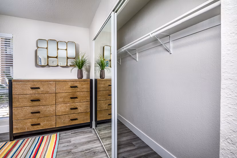 Cozy bedroom featuring modern furnishings and ample natural light at Stone Arbor Apartments