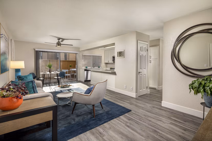 Spacious living room with modern decor at Stone Arbor Apartments, featuring luxury amenities and large windows