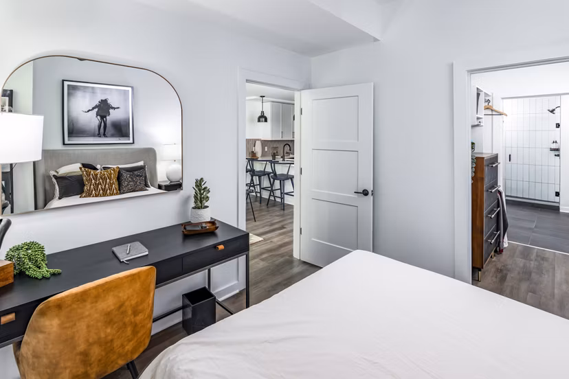 Elegant bedroom with modern decor in Harlowe Apartments, exemplifying luxury living and comfort