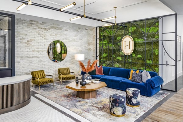 Clubhouse lobby with modern dÃ©cor and communal seating at Harlowe Apartments