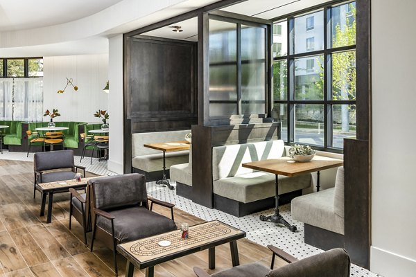 Clubhouse with modern design and comfortable seating at Harlowe Apartments, a luxury Greystar property