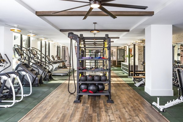 State-of-the-art fitness center with modern equipment at Harlowe Apartments for luxury living in a Greystar community