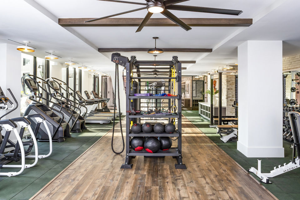 State-of-the-art fitness center with modern equipment at Harlowe Apartments for luxury living in a Greystar community