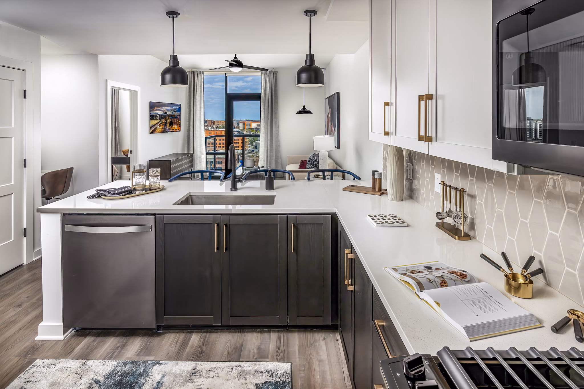 Modern kitchen with stainless steel appliances and sleek countertops at Harlowe Apartments, a Greystar-managed property