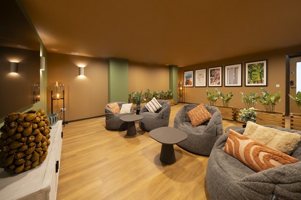 Stylish cinema room at Canvas Glasgow with cozy seating, warm lighting, and a contemporary decor.