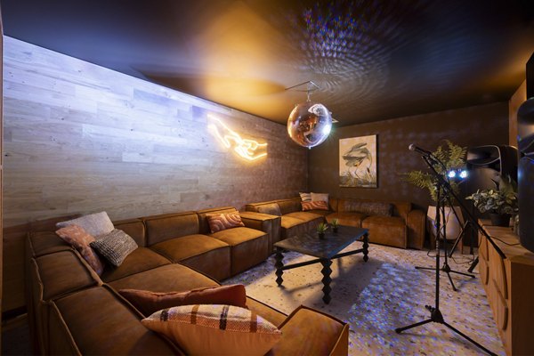 Lounge area at Canvas Glasgow with comfortable seating, decorative accents, and a cozy ambiance.