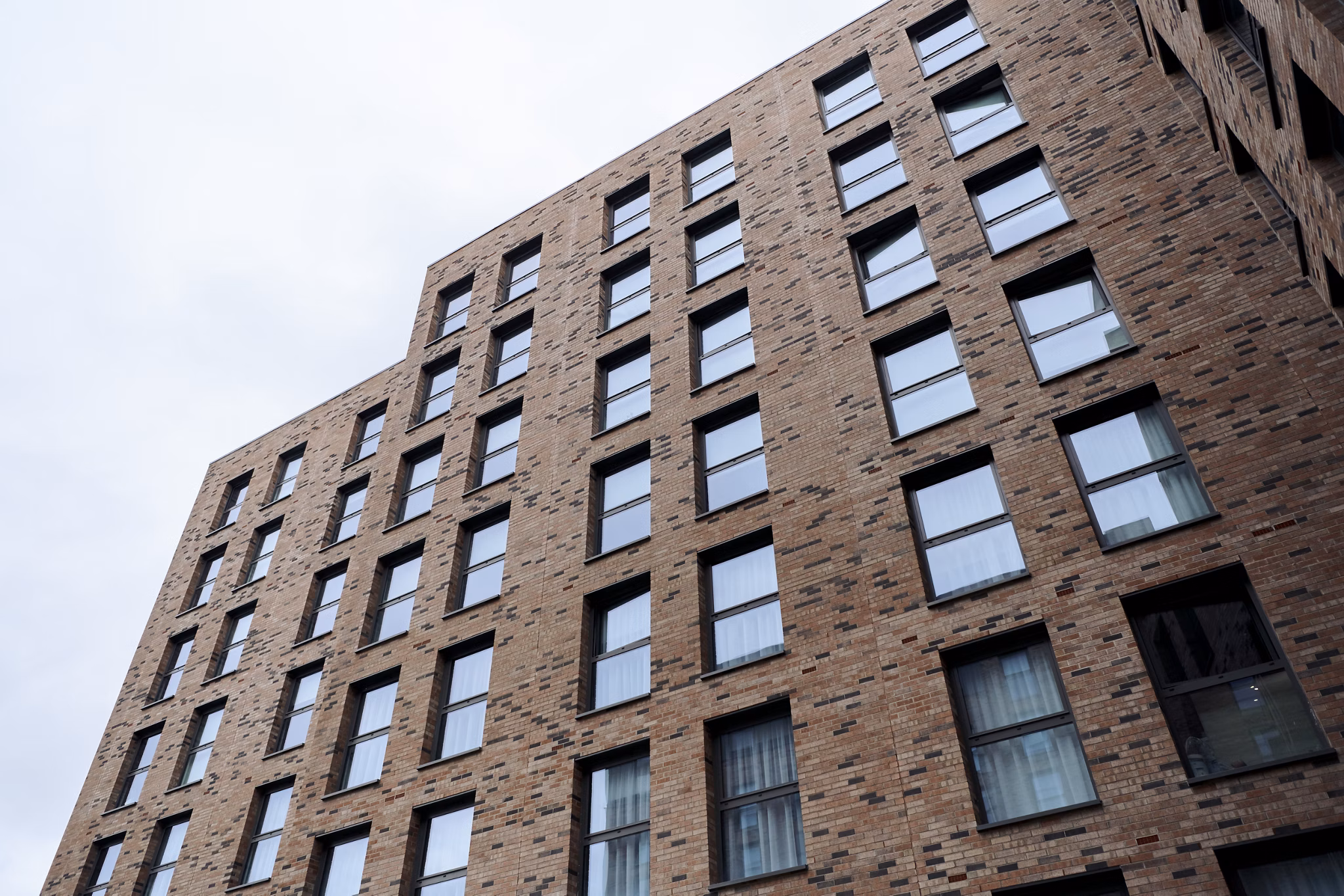 Exterior view of Canvas Glasgow showcasing its brick facade and modern architectural design.