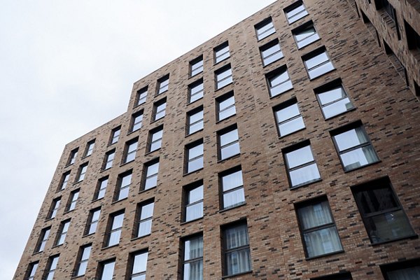 Exterior view of Canvas Glasgow showcasing its brick facade and modern architectural design.