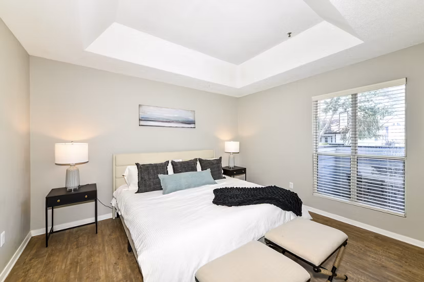 Bedroom featuring cozy decor and natural light at Avana Dunwoody Apartments
