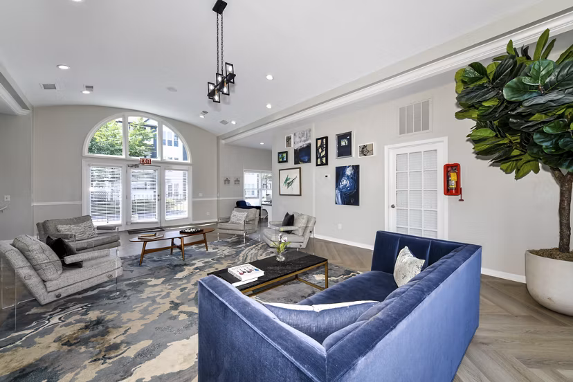 Modern clubhouse featuring cozy seating and vibrant decor at Avana Dunwoody Apartments