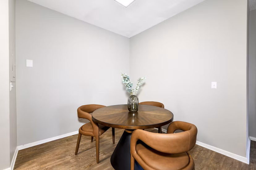 Dining area with modern decor and elegant lighting at Avana Dunwoody Apartments