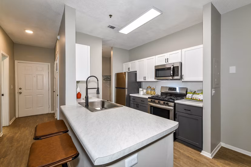 Modern kitchen with stainless steel appliances at Avana Dunwoody Apartments