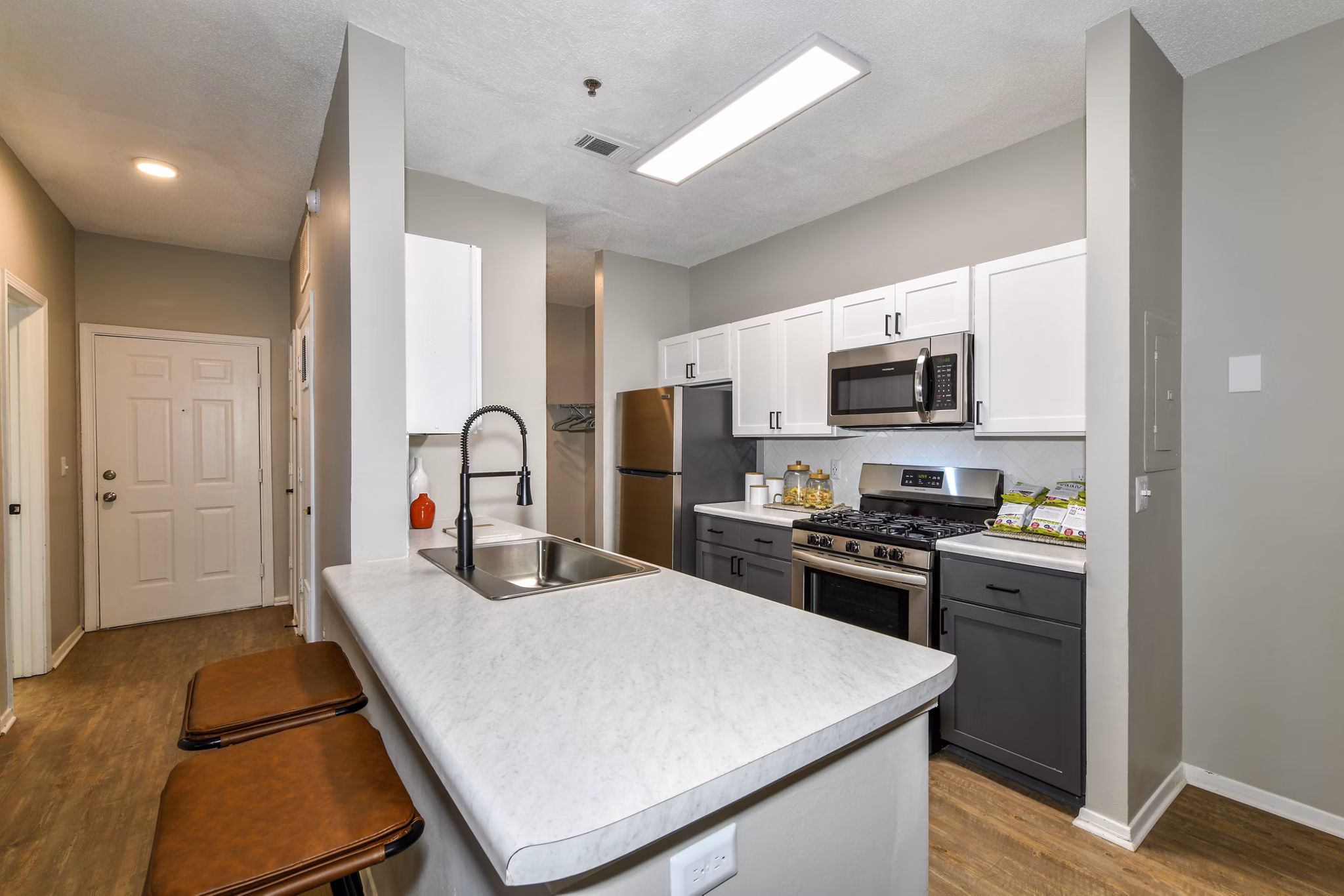 Modern kitchen with stainless steel appliances at Avana Dunwoody Apartments