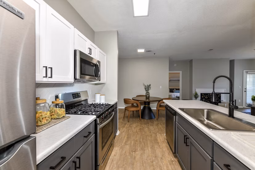 Modern kitchen with stainless steel appliances at Avana Dunwoody Apartments