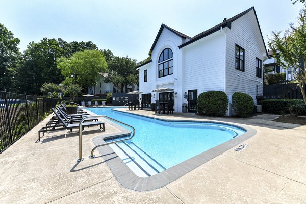 Poolside oasis featuring sparkling waters at Avana Dunwoody Apartments luxury community