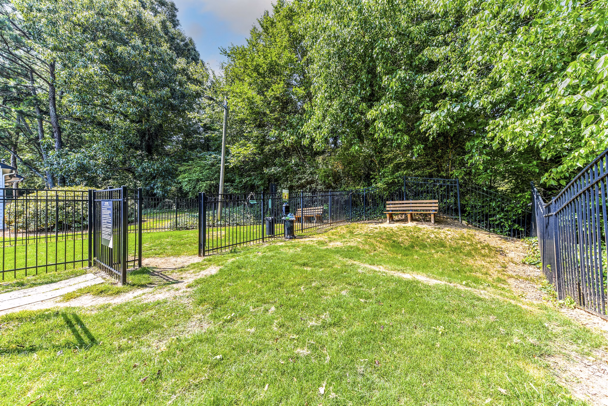 Spacious dog park at Avana Dunwoody Apartments offering recreational spaces for residents' pets