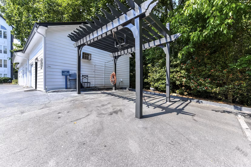 Car care station at Avana Dunwoody Apartments offering convenient on-site vehicle maintenance services