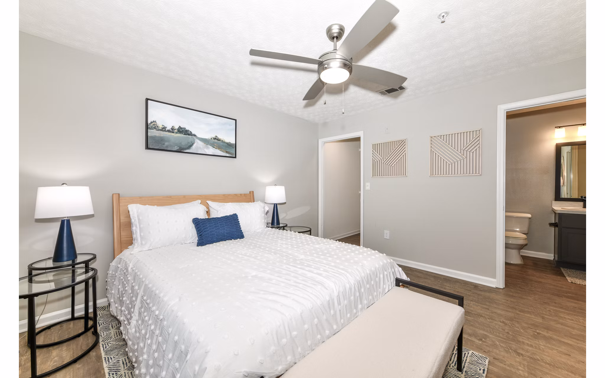 Cozy bedroom with modern decor at Avana Twenty9 Apartments
