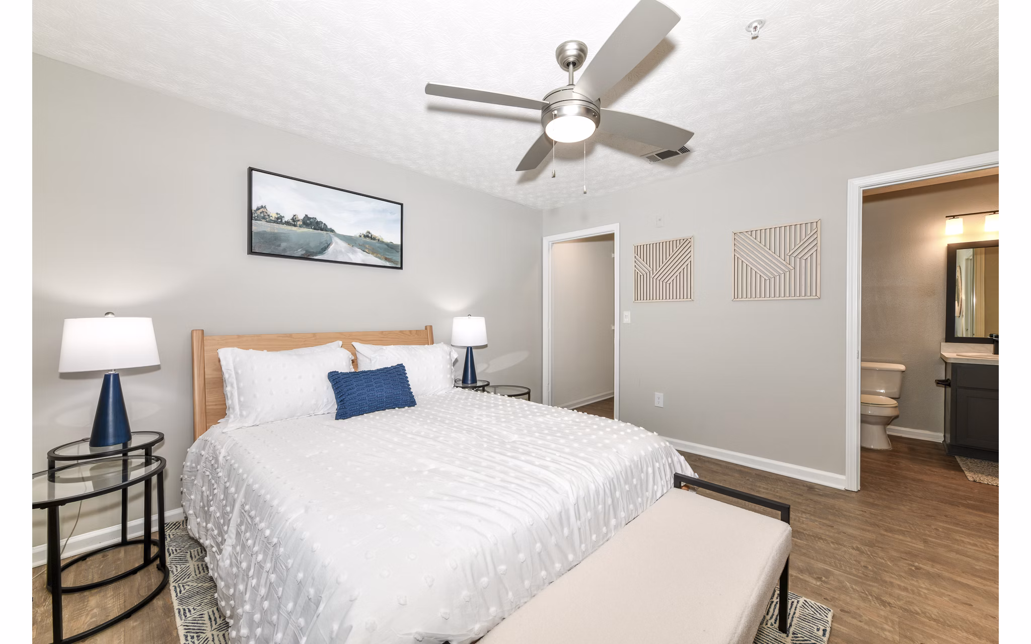 Cozy bedroom with modern decor at Avana Twenty9 Apartments