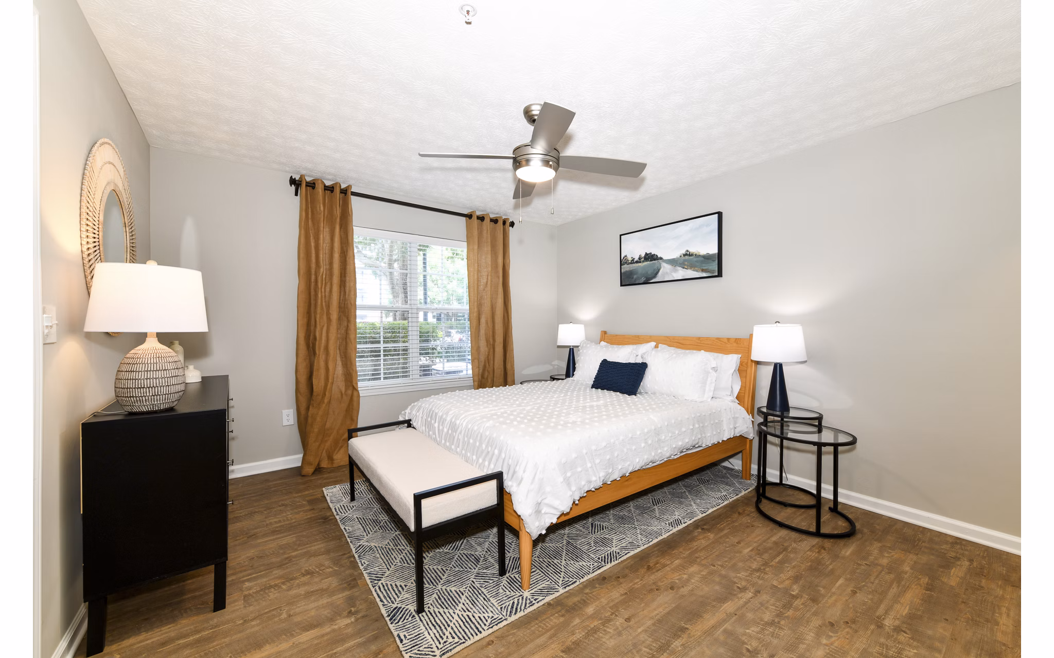 Cozy bedroom featuring elegant decor and soft lighting at Avana Twenty9 Apartments