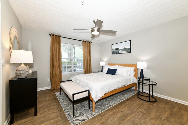 Cozy bedroom featuring elegant decor and soft lighting at Avana Twenty9 Apartments