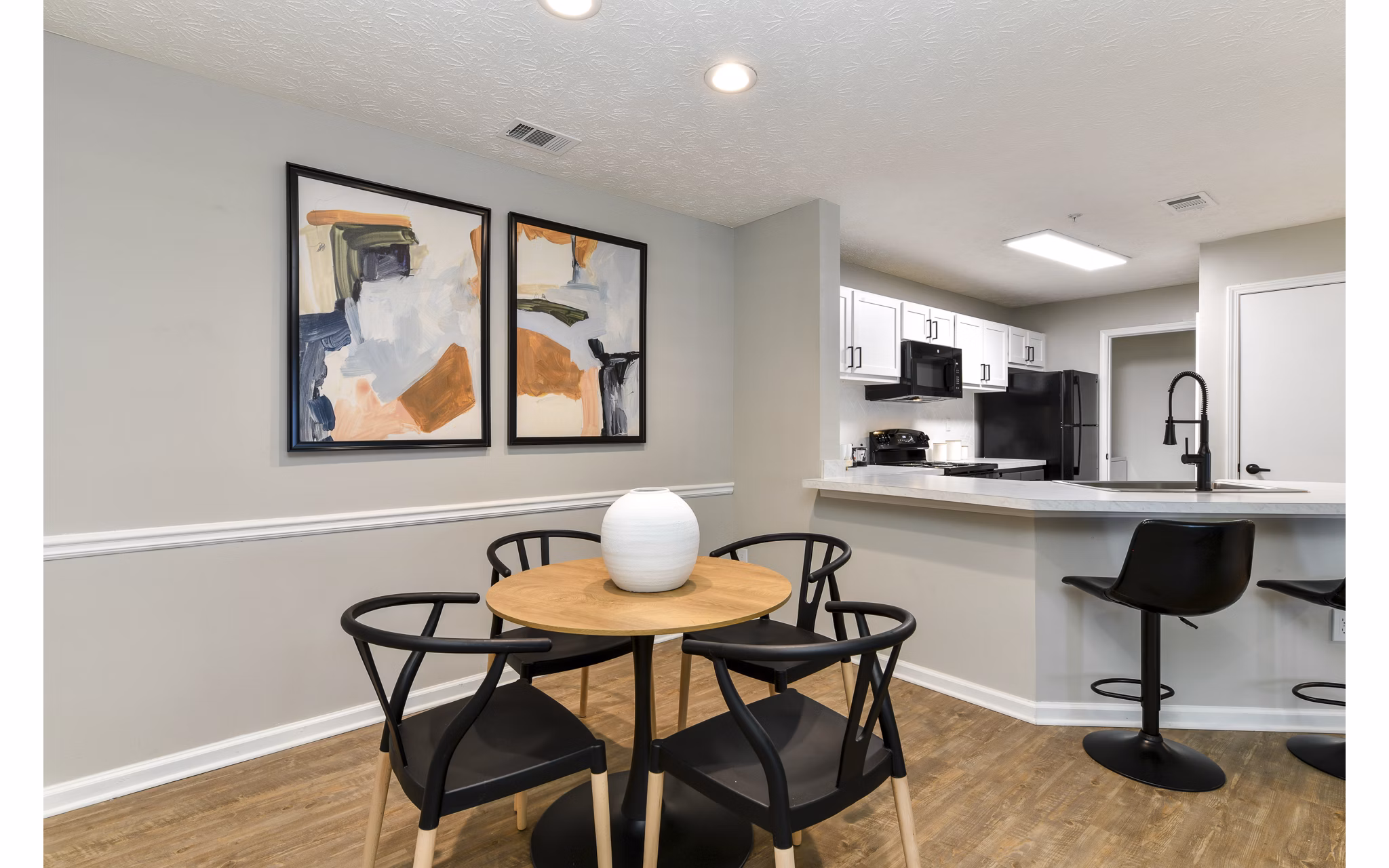 Dining area with modern decor and natural light at Avana Twenty9 Apartments