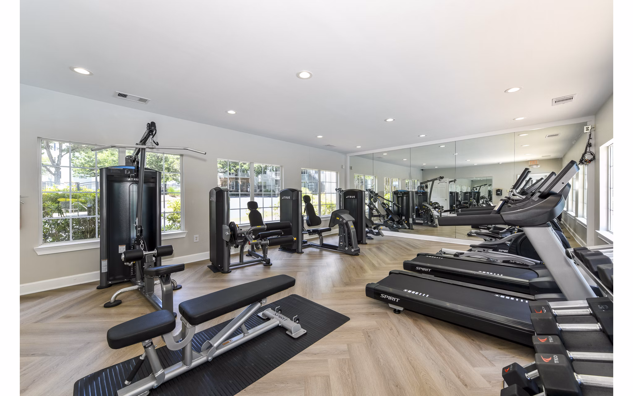 State-of-the-art fitness center with modern equipment at Avana Twenty9 Apartments