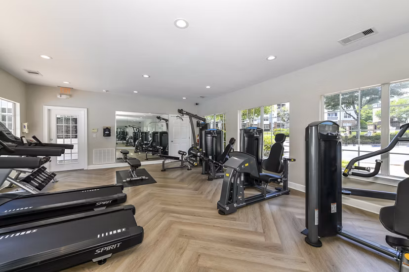 Modern fitness center with state-of-the-art equipment at Avana Twenty9 Apartments, offering a health-focused living experience