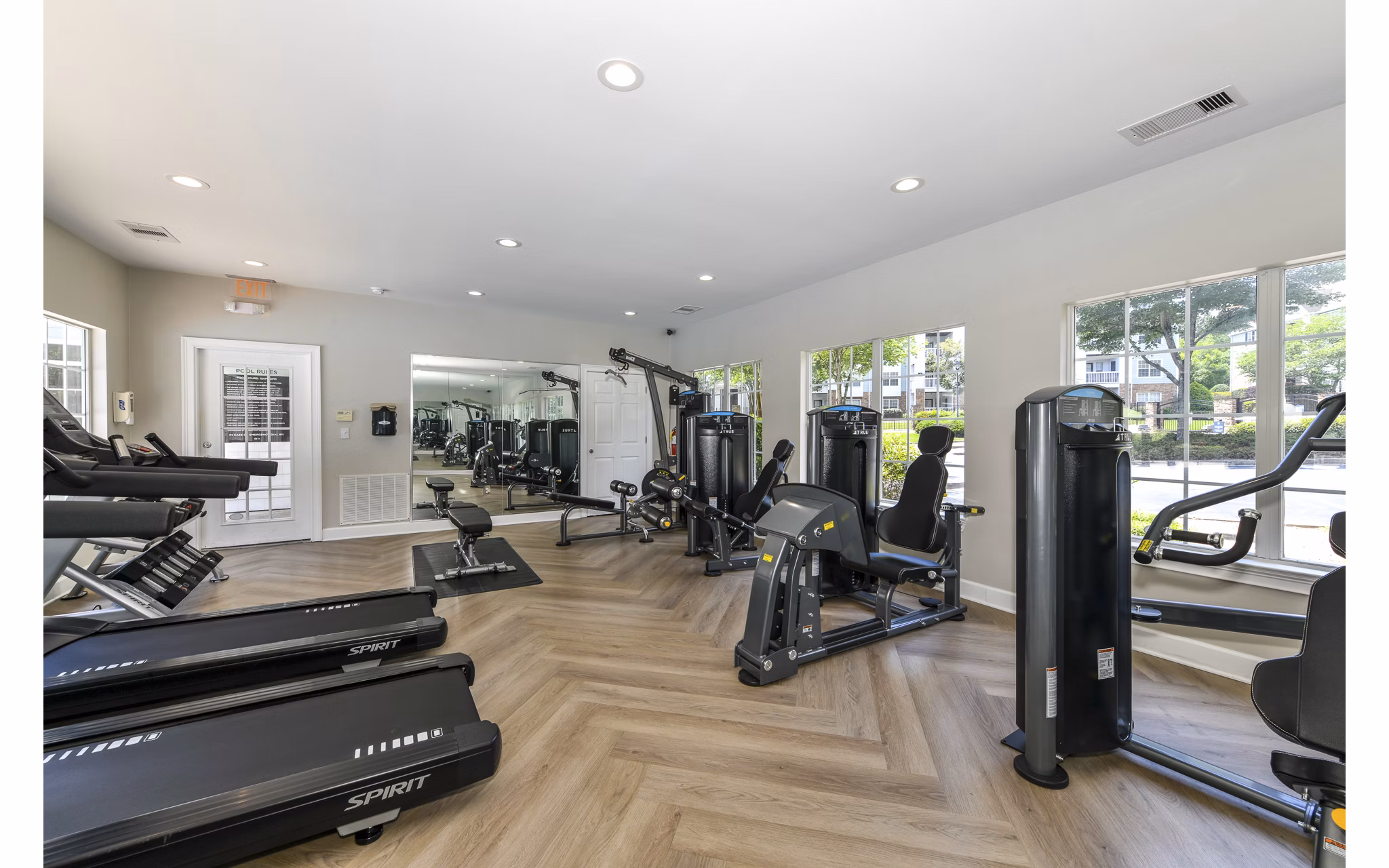 Modern fitness center with state-of-the-art equipment at Avana Twenty9 Apartments, offering a health-focused living experience