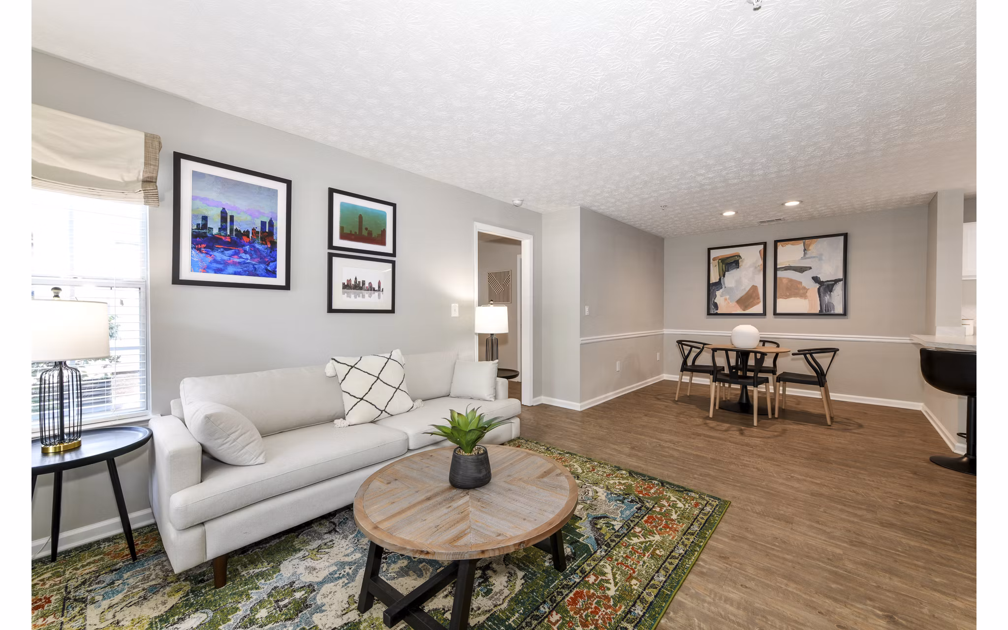 Spacious living room with modern decor in Avana Twenty9 Apartments