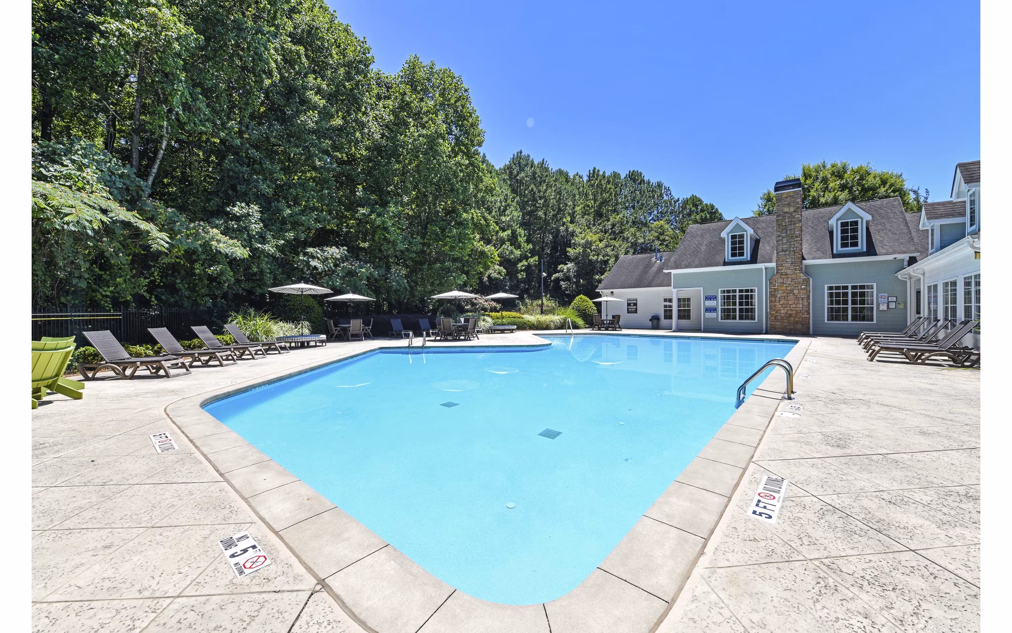 Resort-style pool with sun loungers at Avana Twenty9 Apartments
