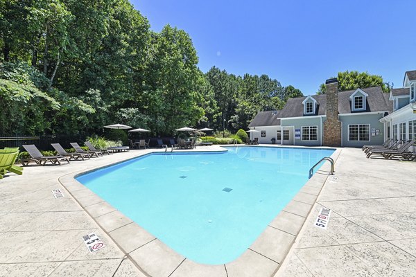 Resort-style pool with sun loungers at Avana Twenty9 Apartments