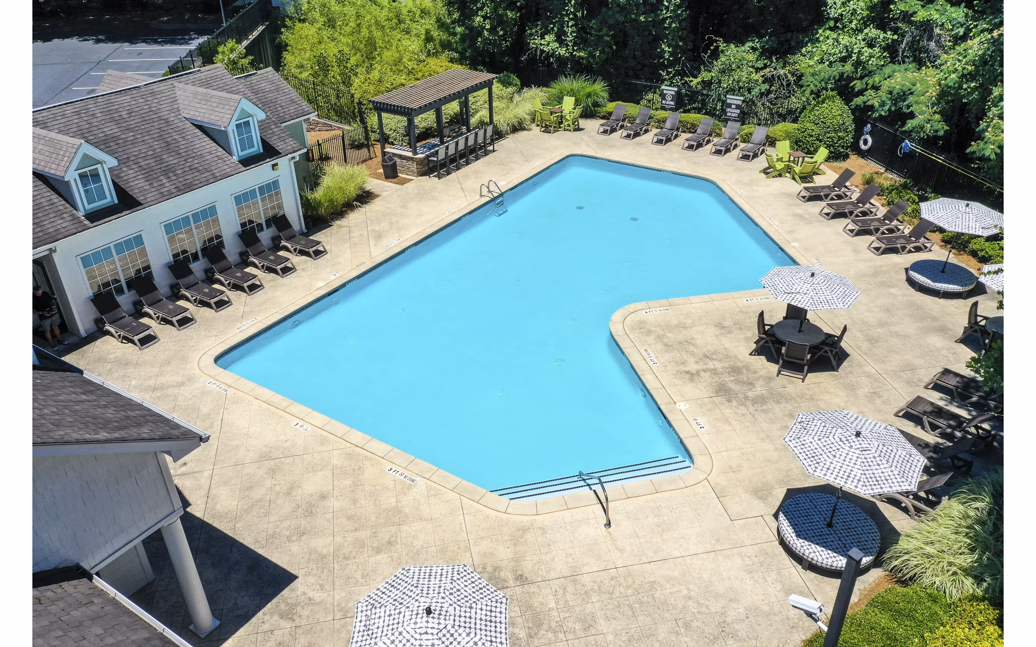 Modern pool area with resort-style seating at Avana Twenty9 Apartments, ideal for relaxation and recreation