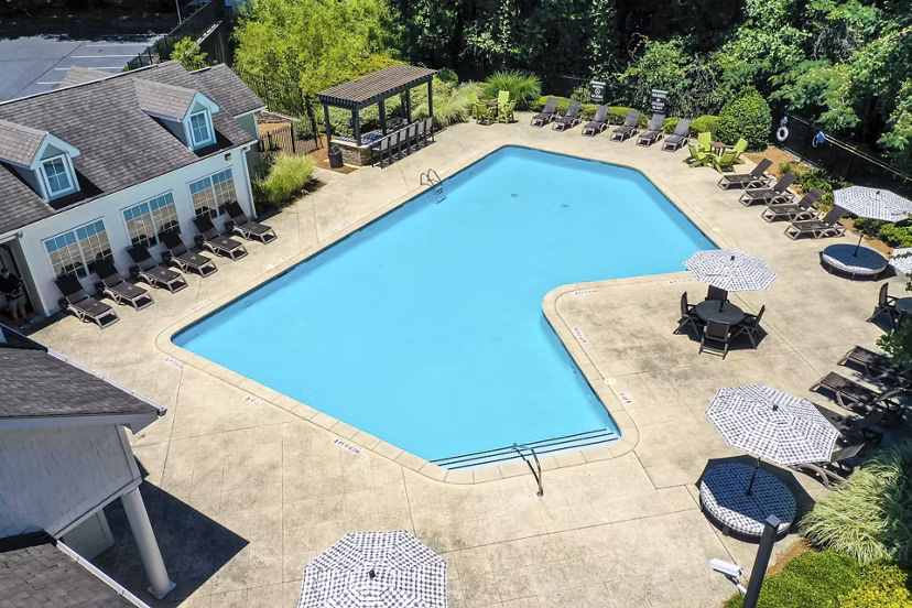 Modern pool area with resort-style seating at Avana Twenty9 Apartments, ideal for relaxation and recreation