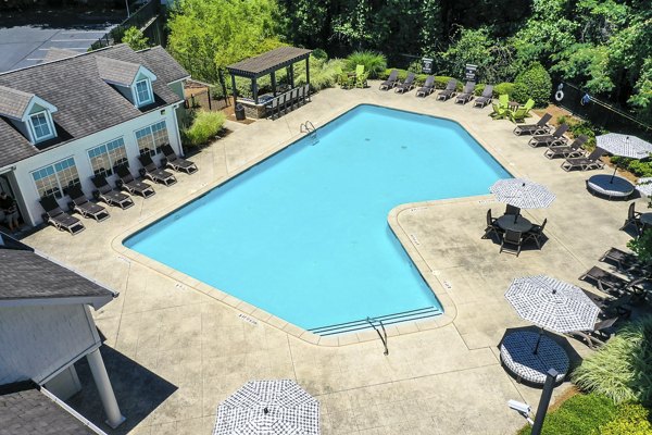 Modern pool area with resort-style seating at Avana Twenty9 Apartments, ideal for relaxation and recreation