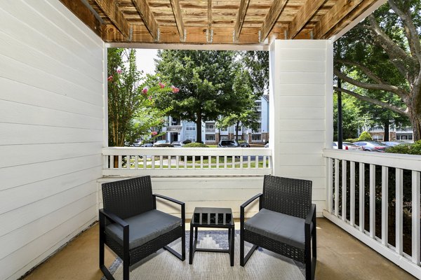 Patio at Avana Twenty9 Apartments: Outdoor seating area with garden views in Greystar luxury apartments