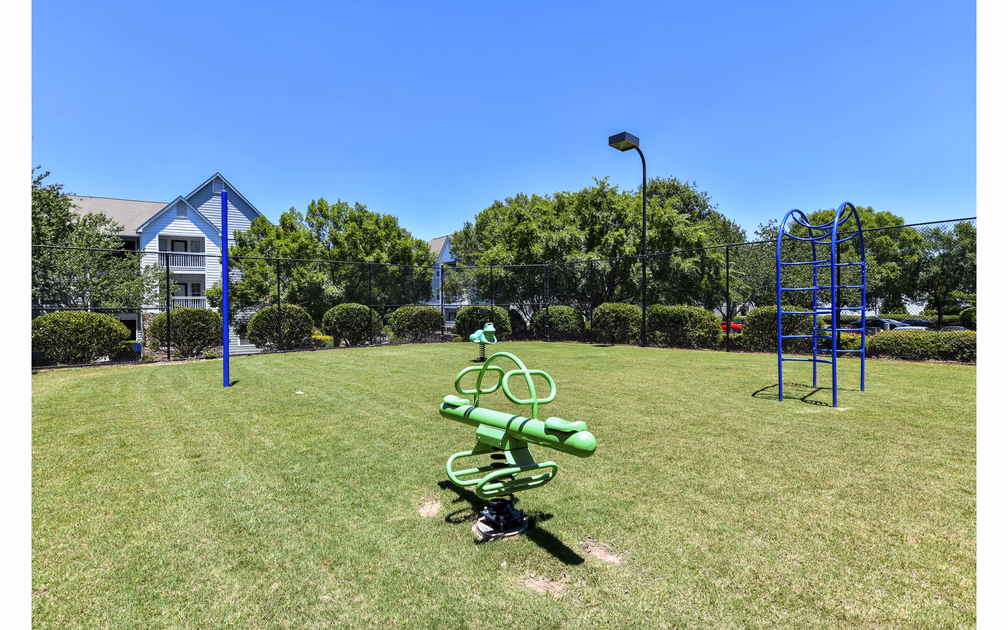 Children's playground with modern equipment at Avana Twenty9 Apartments