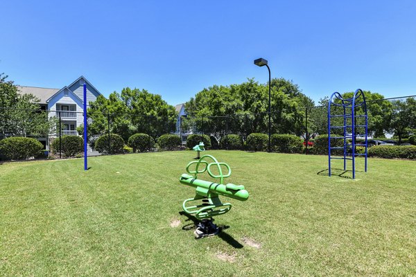 Children's playground with modern equipment at Avana Twenty9 Apartments