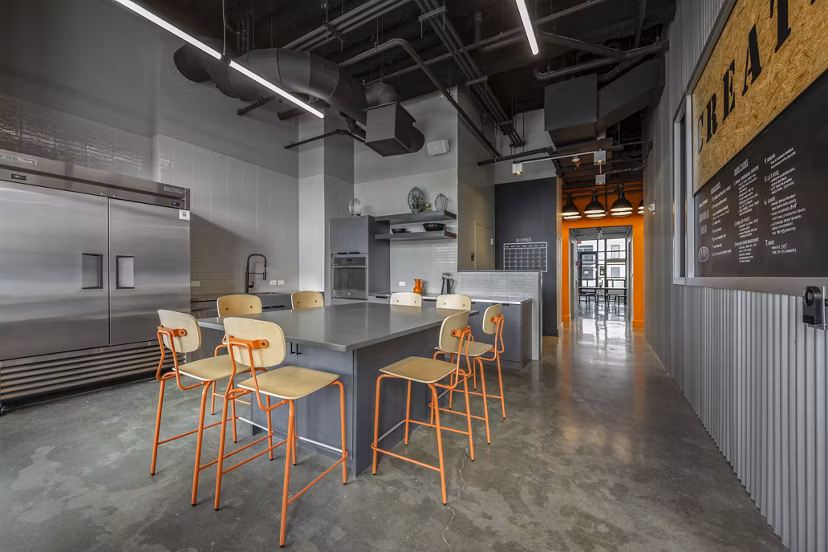 Addison Apartments: Modern clubhouse featuring comfortable seating and a billiards table in luxury apartment complex