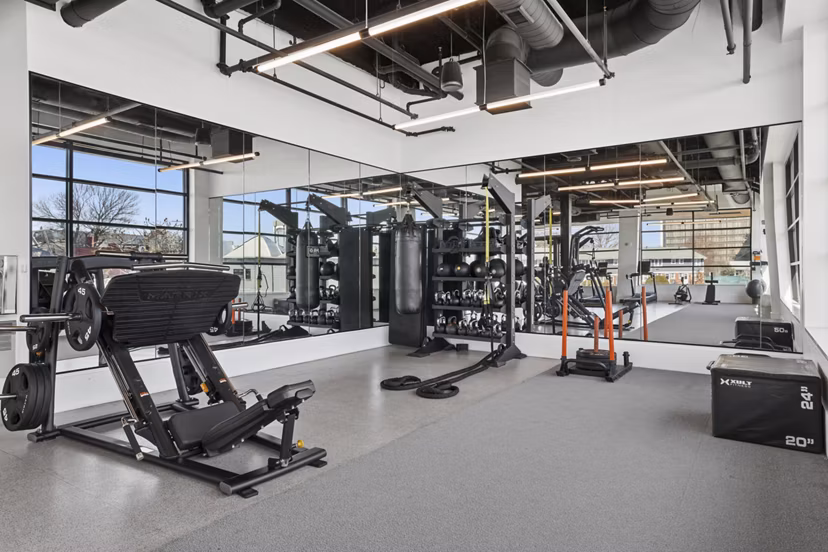 Fitness center featuring modern gym equipment at Addison Apartments for resident wellness activities