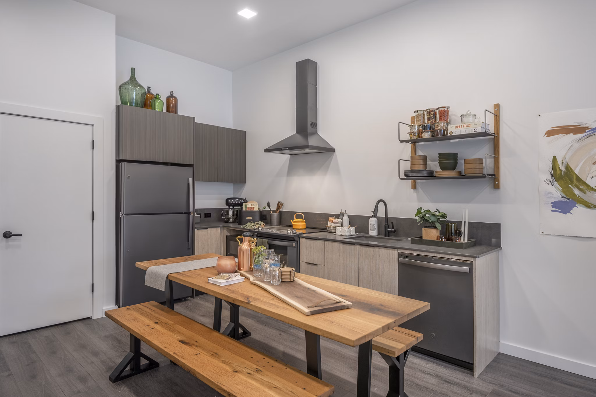 Modern kitchen with stainless steel appliances at Addison Apartments