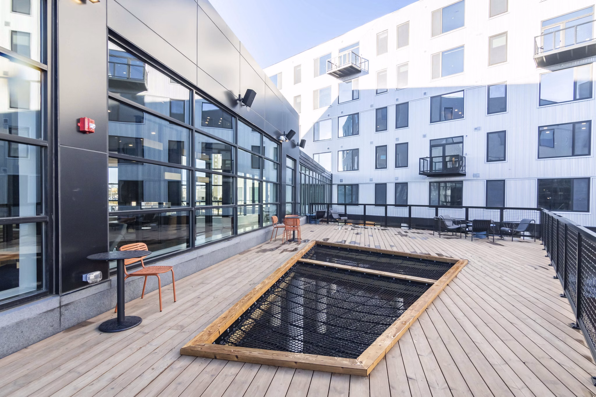 Relaxing rooftop deck with downtown views at Addison Apartments