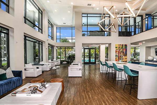 Kestra Apartments: Modern clubhouse with stylish seating and entertainment areas in luxury apartment community