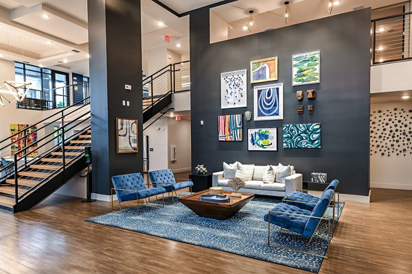 Modern clubhouse with sleek design at Kestra Apartments, showcasing luxury amenities for residents' social gatherings