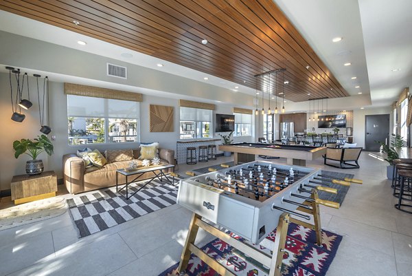 Coastline Ventura Apartments: Modern clubhouse featuring elegant furnishings and natural light, perfect for luxury living in Ventura