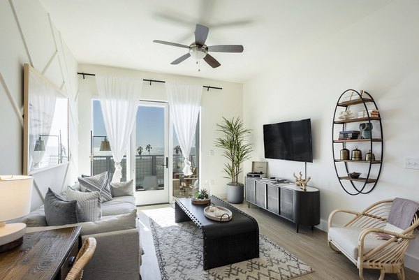 Coastline Ventura Apartments: Modern living room with ocean-inspired decor and sleek furnishings