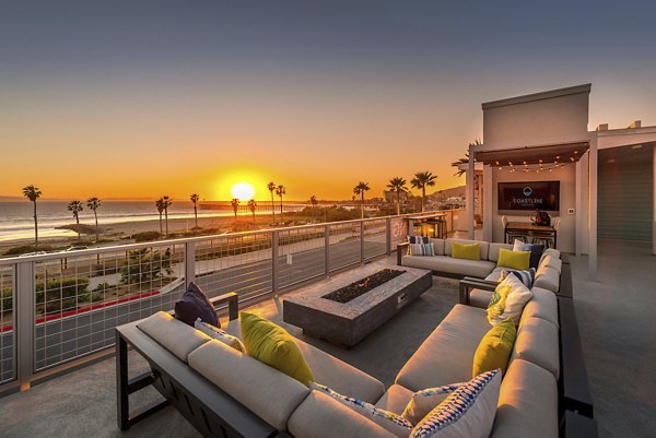 Fire pit area with seating at Coastline Ventura Apartments, perfect for outdoor relaxation and social gatherings